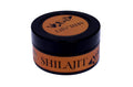 Jar of Shilajit with black lid on a white background